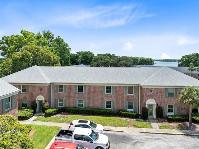 117 Georgetown Dr Unit C, Casselberry, FL 32707 - view of building exterior featuring uncovered parking and a water view