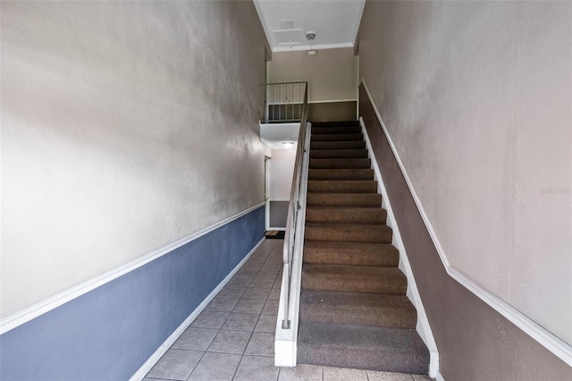 117 Georgetown Dr Unit C, Casselberry, FL 32707 - staircase with tile patterned flooring, baseboards, and ornamental molding