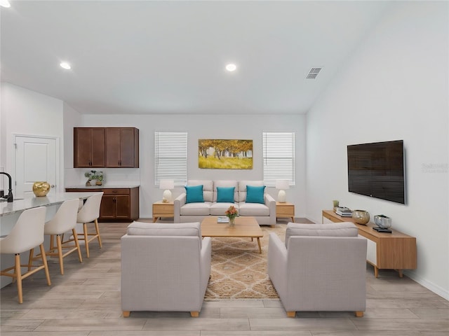 12009 Walmsley Aly, Winter Garden, FL 34787 - living area with light wood finished floors, recessed lighting, and baseboards