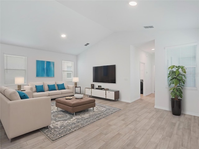 12009 Walmsley Aly, Winter Garden, FL 34787 - living area featuring light wood-style floors, lofted ceiling, baseboards, and recessed lighting