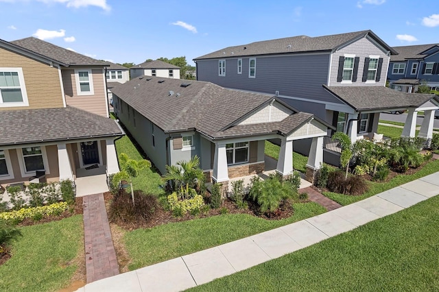 12009 Walmsley Aly, Winter Garden, FL 34787 - view of front of house featuring a front lawn, a residential view, and roof with shingles