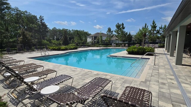 12009 Walmsley Aly, Winter Garden, FL 34787 - community pool with a patio area