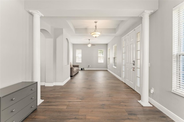 5032 Beach River Rd, Windermere, FL 34786 - entryway with a tray ceiling, dark wood-style flooring, and baseboards