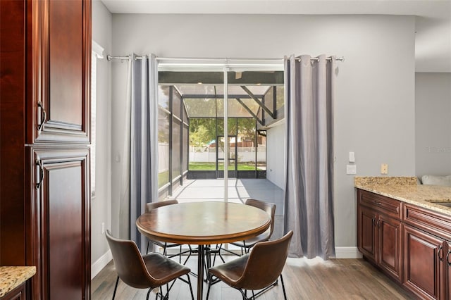 5032 Beach River Rd, Windermere, FL 34786 - dining space featuring light wood finished floors and baseboards