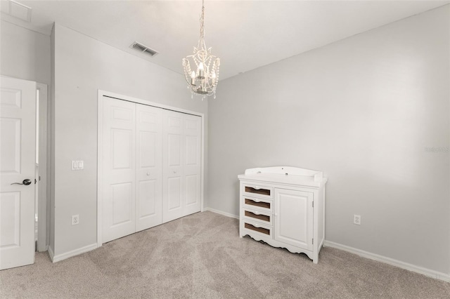5032 Beach River Rd, Windermere, FL 34786 - carpeted bedroom featuring a chandelier, a closet, and baseboards
