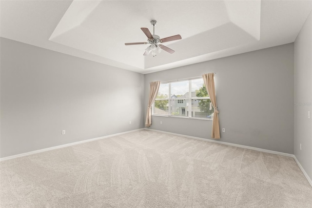 5032 Beach River Rd, Windermere, FL 34786 - carpeted spare room with a tray ceiling, a ceiling fan, and baseboards