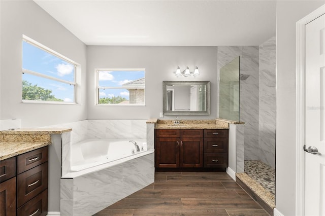 5032 Beach River Rd, Windermere, FL 34786 - bathroom with walk in shower, a bath, vanity, and wood finished floors