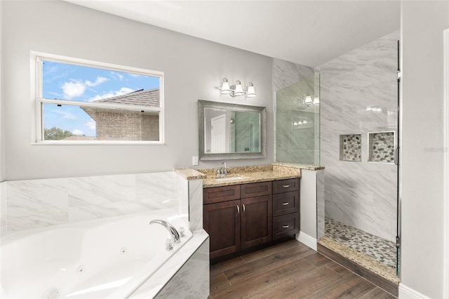 5032 Beach River Rd, Windermere, FL 34786 - bathroom with a walk in shower, a tub with jets, vanity, and wood finished floors