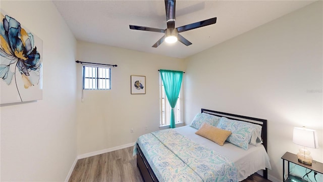 3044 Camino Real Dr S, Kissimmee, FL 34744 - bedroom with wood finished floors and ceiling fan