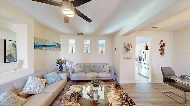 3044 Camino Real Dr S, Kissimmee, FL 34744 - living room with light wood-style flooring and ceiling fan
