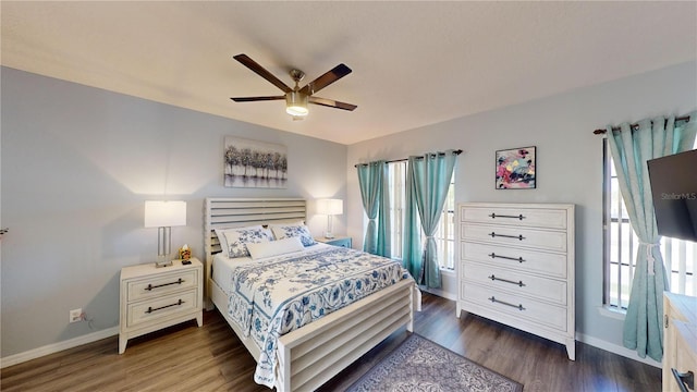 3044 Camino Real Dr S, Kissimmee, FL 34744 - bedroom featuring dark wood-type flooring and ceiling fan
