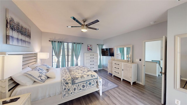 3044 Camino Real Dr S, Kissimmee, FL 34744 - bedroom featuring wood finished floors and ceiling fan