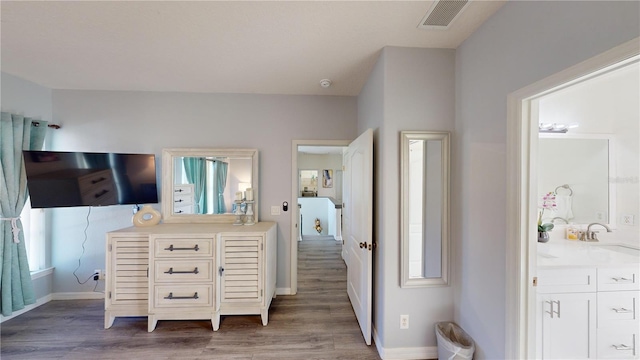 3044 Camino Real Dr S, Kissimmee, FL 34744 - bathroom featuring vanity and wood finished floors