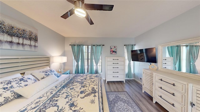 3044 Camino Real Dr S, Kissimmee, FL 34744 - bedroom with dark wood finished floors, multiple windows, and a ceiling fan