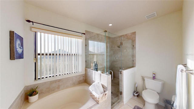 3044 Camino Real Dr S, Kissimmee, FL 34744 - bathroom featuring a garden tub, a stall shower, and tile patterned flooring