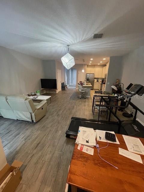 2937 Econ Landing Blvd, Orlando, FL 32825 - living area with wood finished floors and baseboards