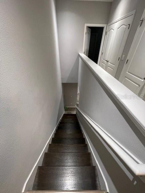 2937 Econ Landing Blvd, Orlando, FL 32825 - stairs with wood finished floors and baseboards