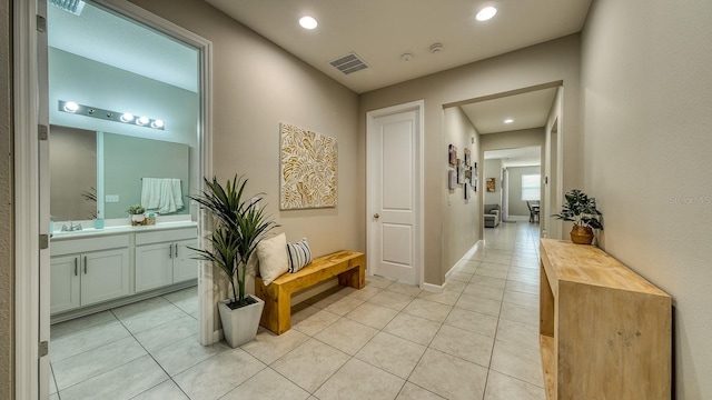 600 Buchannan Dr, Davenport, FL 33837 - corridor with light tile patterned floors, recessed lighting, a sink, and baseboards