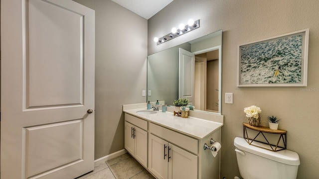 600 Buchannan Dr, Davenport, FL 33837 - bathroom featuring vanity, tile patterned floors, toilet, and baseboards