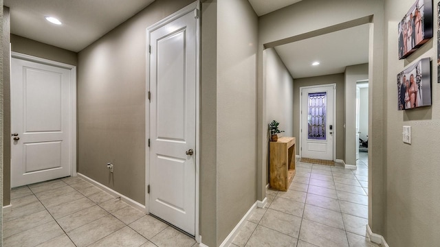 600 Buchannan Dr, Davenport, FL 33837 - hallway featuring light tile patterned floors, baseboards, and recessed lighting