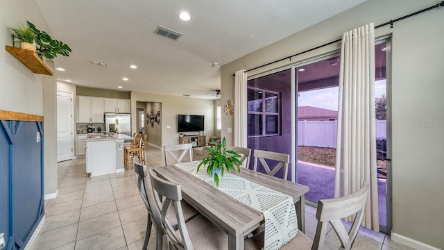 600 Buchannan Dr, Davenport, FL 33837 - dining area featuring baseboards, light tile patterned floors, and recessed lighting