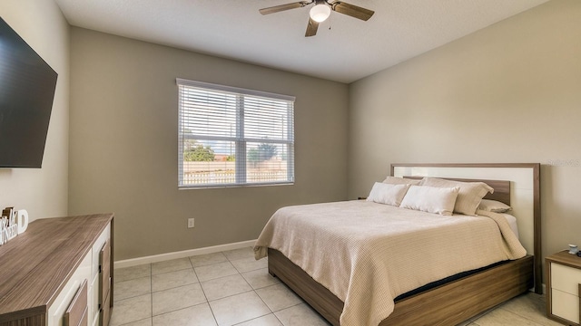 600 Buchannan Dr, Davenport, FL 33837 - bedroom featuring light tile patterned floors, baseboards, and ceiling fan