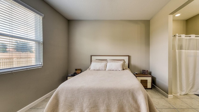 600 Buchannan Dr, Davenport, FL 33837 - bedroom featuring light tile patterned flooring and baseboards