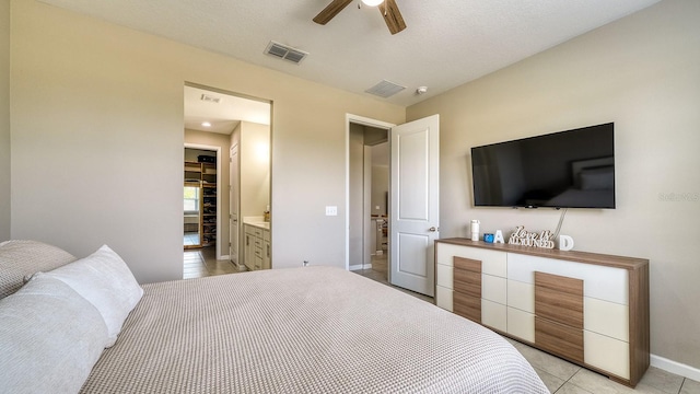 600 Buchannan Dr, Davenport, FL 33837 - bedroom with baseboards, light tile patterned floors, and ceiling fan