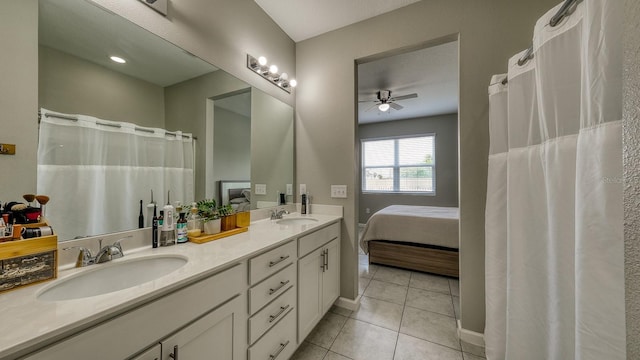 600 Buchannan Dr, Davenport, FL 33837 - ensuite bathroom with a ceiling fan, tile patterned flooring, double vanity, and baseboards