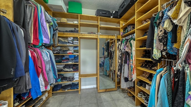 600 Buchannan Dr, Davenport, FL 33837 - walk in closet featuring tile patterned flooring