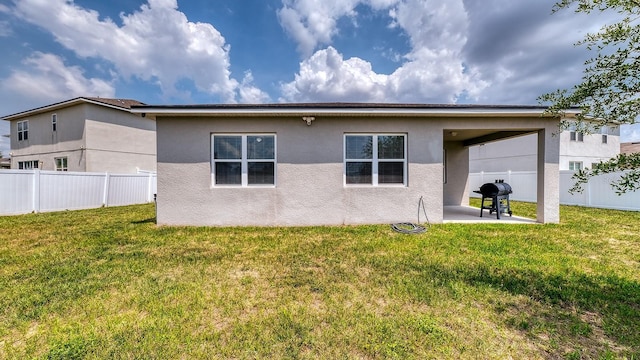 600 Buchannan Dr, Davenport, FL 33837 - rear view of property with a patio and stucco siding