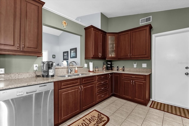 2344 Whispering Maple Dr, Orlando, FL 32837 - kitchen with stainless steel dishwasher, a sink, light tile patterned flooring, glass insert cabinets, and light stone countertops