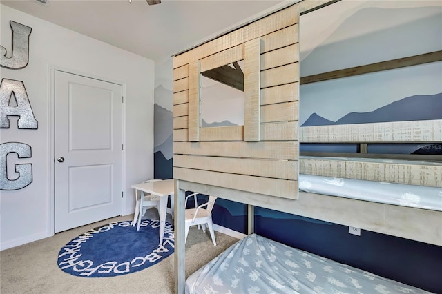 mudroom with carpet floors and baseboards