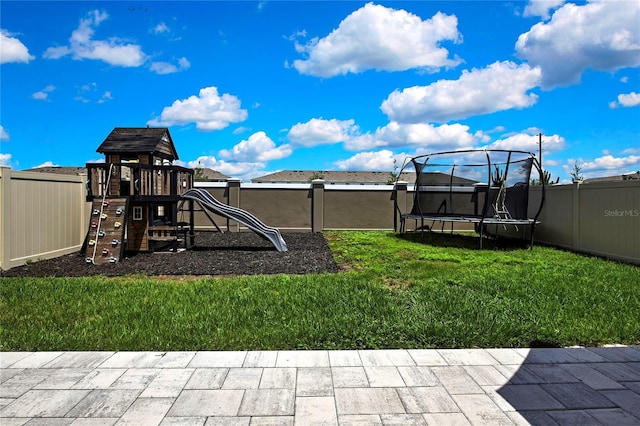 view of jungle gym with a trampoline