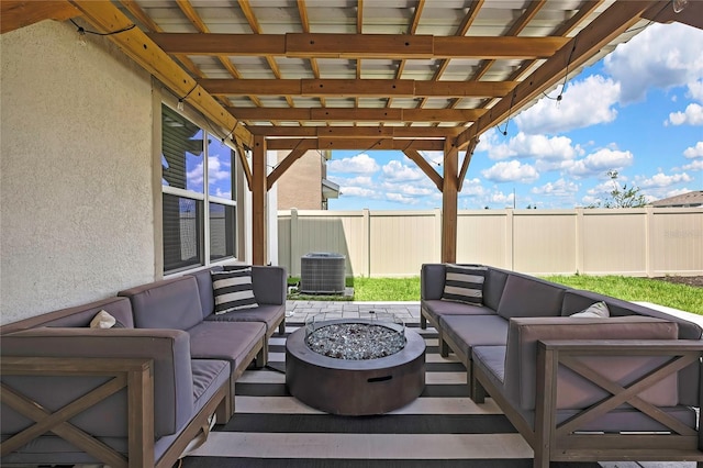 view of patio / terrace featuring an outdoor living space with a fire pit and cooling unit