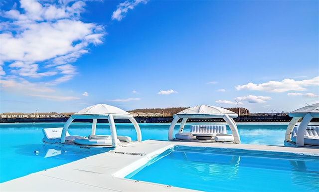 view of swimming pool with a gazebo and a swimming pool