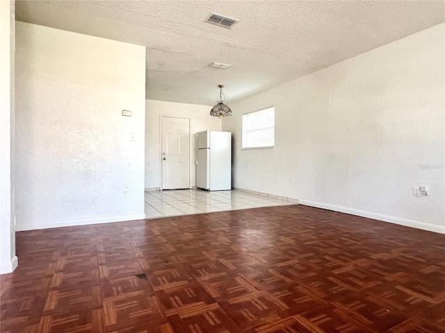 501 Las Palmas Cir Unit 676, Avon Park, FL 33825 - empty room featuring baseboards and a textured ceiling