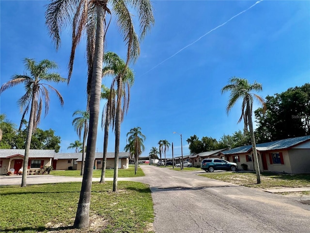 501 Las Palmas Cir Unit 676, Avon Park, FL 33825 - view of asphalt road with street lighting