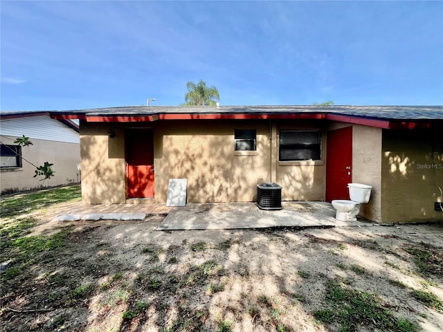 501 Las Palmas Cir Unit 676, Avon Park, FL 33825 - back of house with stucco siding, a patio area, and central AC unit
