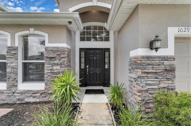 10293 Cypress Knee Cir, Orlando, FL 32825 - entrance to property with stone siding and stucco siding