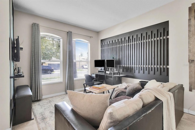 10293 Cypress Knee Cir, Orlando, FL 32825 - living room with healthy amount of natural light, baseboards, and a desk
