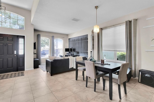 10293 Cypress Knee Cir, Orlando, FL 32825 - dining space featuring healthy amount of natural light, light tile patterned flooring, and baseboards