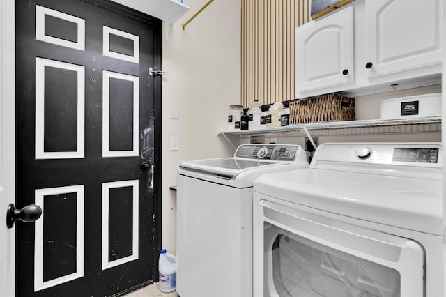 10293 Cypress Knee Cir, Orlando, FL 32825 - laundry area featuring separate washer and dryer and cabinet space