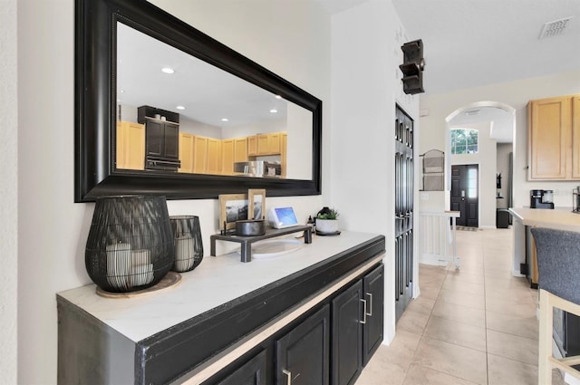 10293 Cypress Knee Cir, Orlando, FL 32825 - bar area with arched walkways, recessed lighting, and light tile patterned flooring