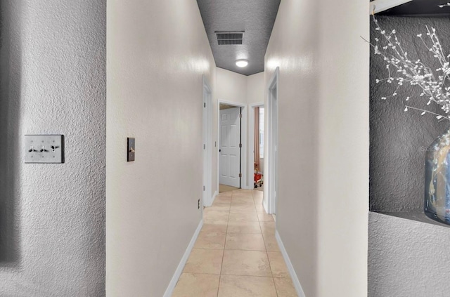 10293 Cypress Knee Cir, Orlando, FL 32825 - hallway with light tile patterned floors and baseboards