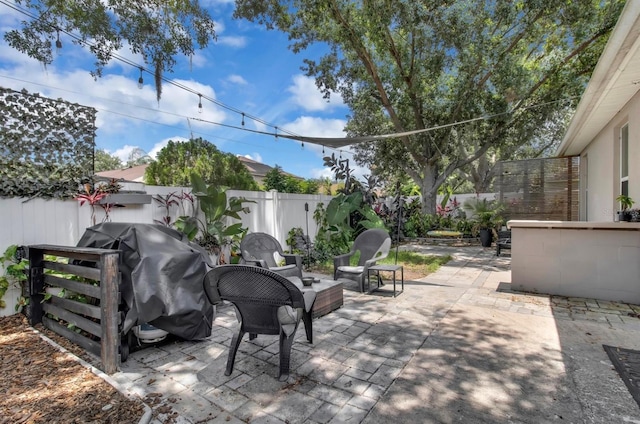 10293 Cypress Knee Cir, Orlando, FL 32825 - fenced backyard featuring a patio area and area for grilling