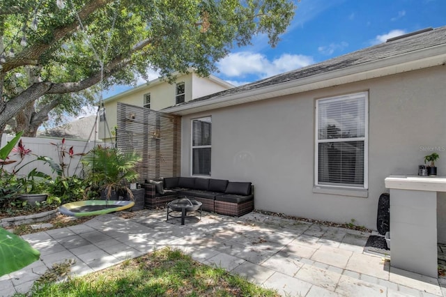 10293 Cypress Knee Cir, Orlando, FL 32825 - view of patio with an outdoor living space with a fire pit
