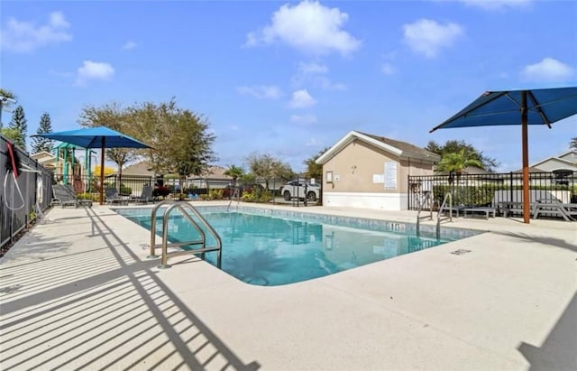 10293 Cypress Knee Cir, Orlando, FL 32825 - community pool featuring a patio area