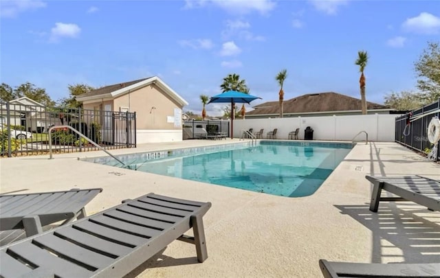 10293 Cypress Knee Cir, Orlando, FL 32825 - community pool featuring a patio