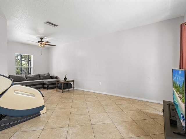 437 Bridgewater Ct, Kissimmee, FL 34758 - living room featuring ceiling fan, light tile patterned floors, and baseboards
